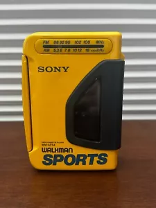 🔥 SONY SPORTS WALKMAN WM-AF54 CASSETTE PLAYER + SRF-9 AM/FM RADIO – YELLOW🔥 - Picture 1 of 11