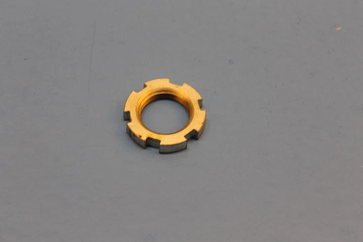 NOS YAMAHA AS2 AT1 AT2 AT3 DT1 DT100 SPECIAL SHAPE NUT PART#90179-25033-00 - Image 1 of 1