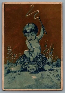 Trade Card c1880s Victorian Cherub Riding Tortoise With a Whip - Bild 1 von 3