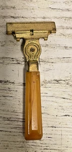 Maquinilla de afeitar inyectora Schick vintage caramelo baquelita mango pat EE. UU. - Imagen 1 de 9