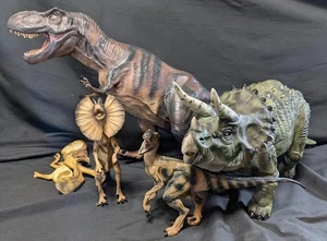 FIGURA Juego de Vinilos Blandos Parque Jurásico Paquete de 4 T-Rex 1:10 Triceratops Raptor - Imagen 1 de 12