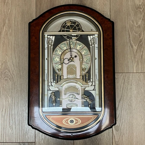 Rhythm Small World Sign of the Times Magic Sound & Motion Zodiac Clock 4MH744NR Cover