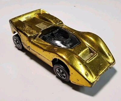 McLaren M6A 1/64 diecast vintage Hot Wheels Redline Grand Prix US Gold Foto 1 de 4