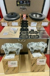 2005-2023 TOYOTA TACOMA 4WD GENUINE OEM FRONT BRAKE CALIPERS ROTORS PADS &SHIMS - Picture 1 of 18