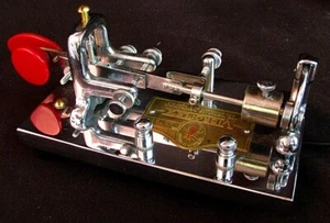 LLAVE TELEGRÁFICA VIBROPLEX BUG CROMADA con PERILLAS DE LLAVE ROJAS ¡BONITA!! - Imagen 1 de 4