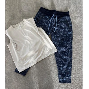 Conjunto de camiseta sin mangas y joggers florales atléticos Athleta ropa deportiva para salón de entrenamiento L/XL - Imagen 1 de 11