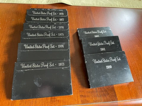 Lot of 10 US Proof Sets one each of 1973-1982 in boxes Cover