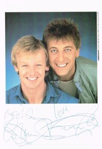 LES DENNIS AND DUSTIN GEE SIGNED CARD SIZE: 4 X 6 INCH BRITISH COMEDIANS