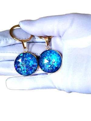 Pendientes de ópalo Pendientes de ópalo de resina azul hielo en aros de acero inoxidable de 18 kgp 25 mm Foto 1 de 3