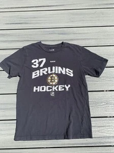 Reebok Boy’s Sz L (14-16) Boston Bruins Center Ice #37 Bergeron T-Shirt Jersey - Picture 1 of 5