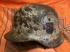 WW2 German M40 helmet in winter camouflage.Size outside 67.The metal is strong.