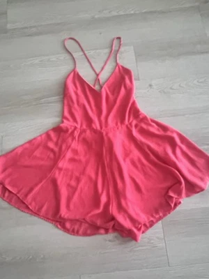 Mameluco Express coral cruzado trasero para mujer  Foto 1 de 4