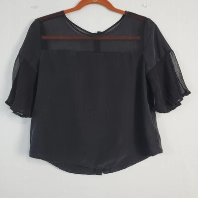 Top trasero con botones manga aleteada de seda Amour Vert talla XS negro puro capricho EE. UU. Foto 1 de 4