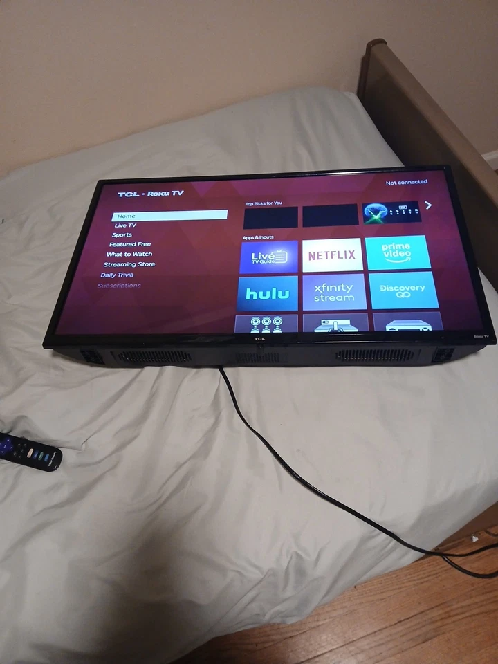42 Inch TCL Wall Mounted  TV. Has Two Remotes And Lots Of Different Apps. - Image 1 of 1