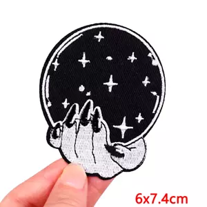 Hand holding globe patch applique Embroidered Iron on 3 inches x 2.25 inches - Picture 1 of 1