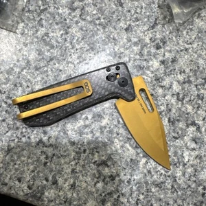SOG Knives Ultra XR Black Carbon Fiber Scales and Gold S35VN Stainless Blade - Picture 1 of 2