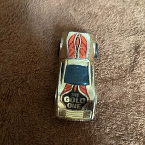 LOOSE 1:64 HOT WHEELS 1977 GOLD CHROME BUZZ -OFF/ HONG KONG BASE - Picture 1 of 10