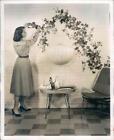 1954 Press Photo Home Decor Fruit And Leaf Spray Across White Brick - ner31335
