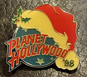 Planet Hollywood 98 Christmas Pin-Santa Hat W/Holly On Blue Earth W/Stars 1.5” - Picture 1 of 3