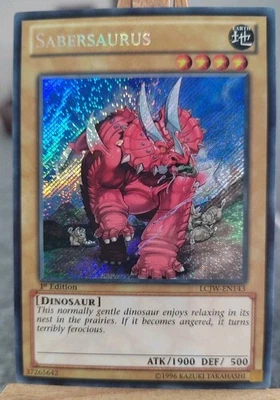 SABERSAURUS - LCJW-EN143 Secret Rare / 1st Edition Near Mint English - Bild 1 von 2