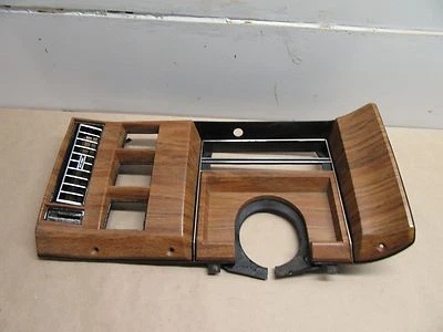 1977-1989 CADILLAC DEVILLE FLEETWOOD CLUSTER BEZEL LIGHT WOODGRAIN  - Image 1 of 4