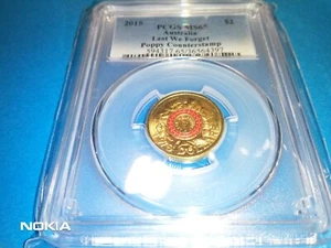 2015 $2 RED LEST WE FORGET POPPY COUNTERSTAMP COIN - Picture 1 of 11