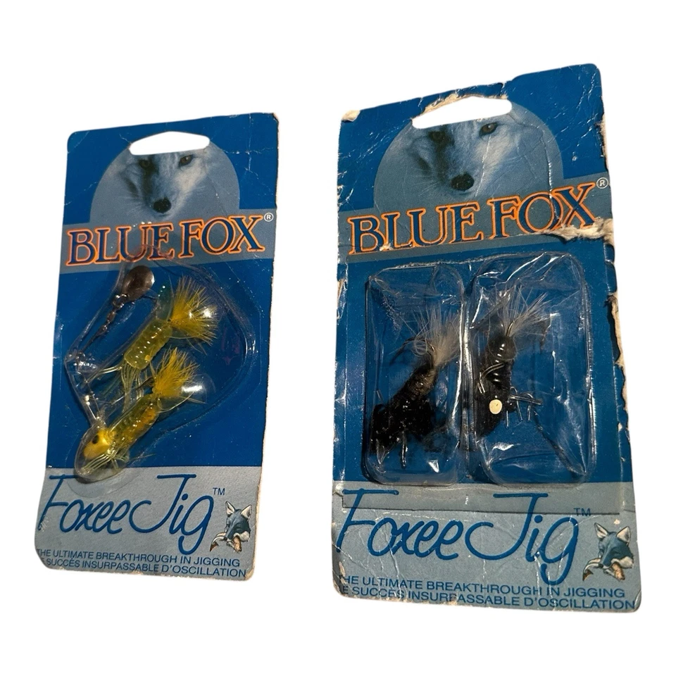 Lote de 2 señuelos de pesca Blue Foxee Jig de colección como nuevos 1988 EE. UU. negro amarillo Foto 1 de 4