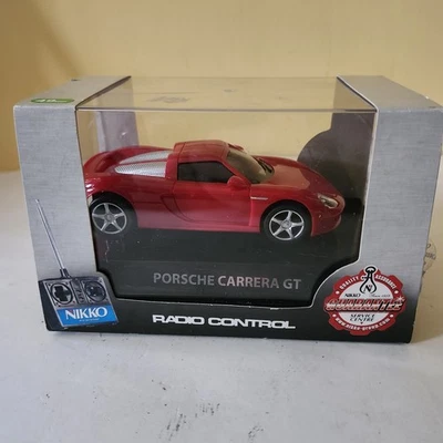 RC Auto Nikko Porsche Carrera GT Open Box - Maßstab 1:32 Koffer + Ständer getestet Vintage lesen - Bild 1 von 4