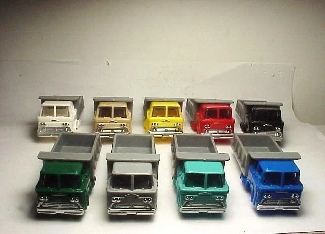 MODEL MOTORING  3 DUMP TRUCKS W/GRAY DUMP BED. MOLDED PLASTIC . SUMMER SALE !!!! - Image 1 of 1