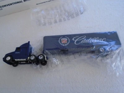 #T057  ERTL 1:64 DIE CAST  WHITE GMC TRACTOR  TRAILER CADILLAC - Image 1 of 4