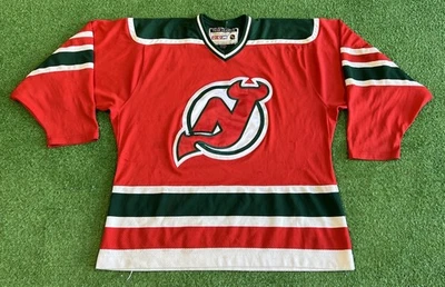 New Jersey Devils Hockey NHL Jersey CCM Talla Grande Auténtico Rojo Deportes NJ Verde Foto 1 de 4