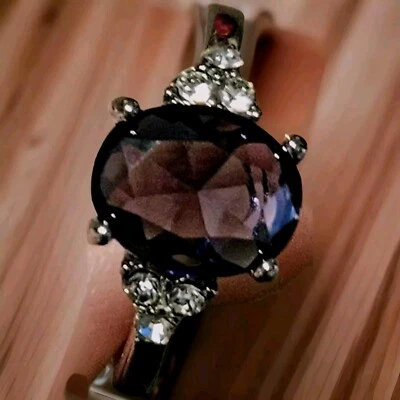 White Gold Plated Ring with 1 Cz Purple Center Gem and 6 Side Cz Gems, Size 8 - Image 1 of 4