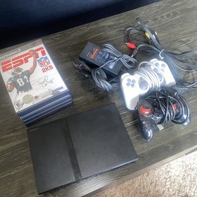 Sony PlayStation 2 Slim With Controllers And Games