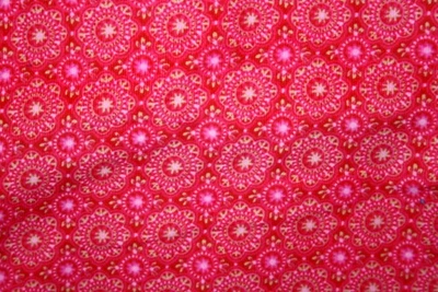 PINK AND YELLOW CIRCULAR DESIGN ON RED CORDUROY - 100% COTTON FABRIC - Image 1 of 3