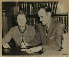 Press Photo Woman & Man Sit At Table In Office - Sas22026