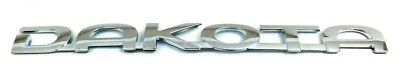 2005-2011 Dodge Dakota rear tailgate chrome Nameplate Emblem Badge 55077722AA - Image 1 of 3