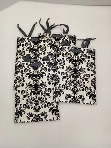 Luxus Silhouette Geschenktüten 4er Set Fluer de Luis Muster mit schwarzem Seilgriff - Bild 1 von 4