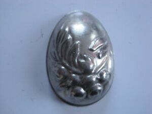 Vintage very small tin half chocolate egg mould  55 mm with flower spray
