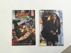 Loot Crate Exclusive Street Fighter und IWC Orphan Black ~ 2 Bücher - Bild 1 von 2