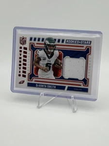 DeVonta Smith 2024 Panini Rookies & Stars NFL Authentic MEM NA-DSH - Picture 1 of 2