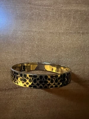 Brazalete Coach Signature esmaltado usado Foto 1 de 4
