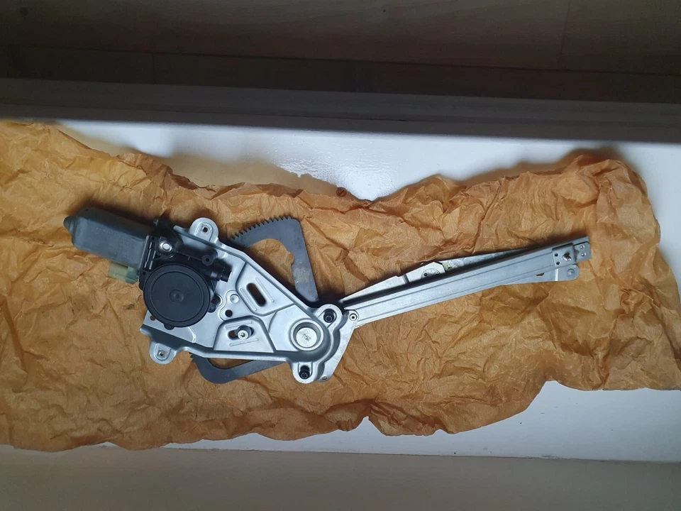 Jaguar XK8 - Regulador e motor de janela frontal esquerda - GJA17301AD - Imagem 1 de 1