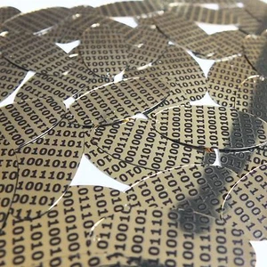 Lentejuela ovalada 1,5" oro negro código técnico binario impresión metálica - Imagen 1 de 1