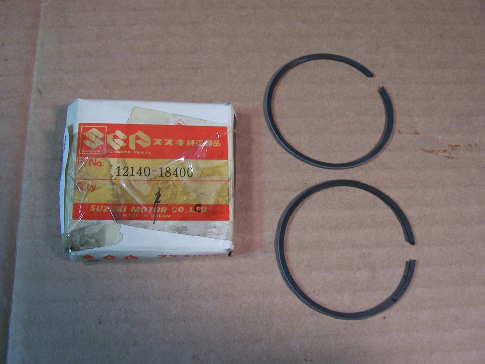 SUZUKI T250 NEW NOS OEM STANDARD PISTON RING SET  T 250 1969-1971 12140-18400 - Image 1 of 1
