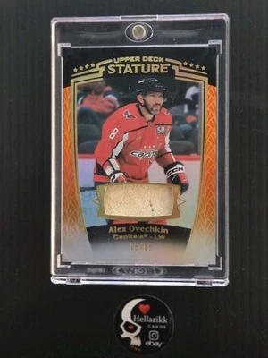 2024-25 Alex Ovechkin/15 Estatura Premium Guante Naranja #14 Washington Cubierta Superior Foto 1 de 2
