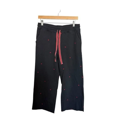 Pantalones deportivos Sundry para mujer con bolsillos acampanados con corazones en negro/azul marino y rojo talla M Foto 1 de 4