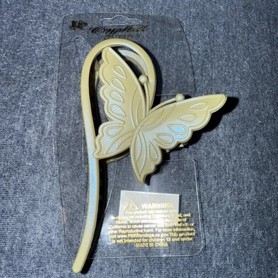 Garra de pelo de mariposa gris por cristal Foto 1 de 4