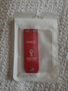 Coca-Cola official FIFA World Cup Qatar 2022 Finger grip adhesive phone strap - Zdjęcie 1 z 3
