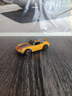 Hot Wheels Redline Porsche P-911 amarillo vintage 1975 colores voladores Foto 1 de 4