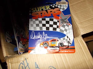 #10 PURALATOR DERRIC COPE 1/64 MATCHBOX CASE 12 DEAL FULL FRESH FROM THE FAC - Bild 1 von 1